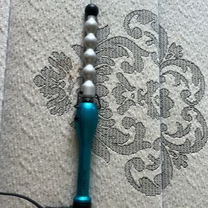 A bed head curling iron used once